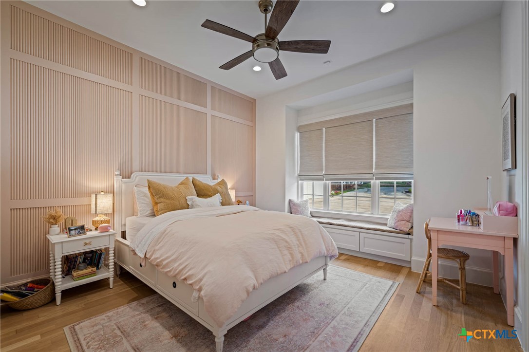 1755 Riada Drive New Braunfels, TX 78132 - Photo 23 of 48 a bedroom with a bed and a table in it