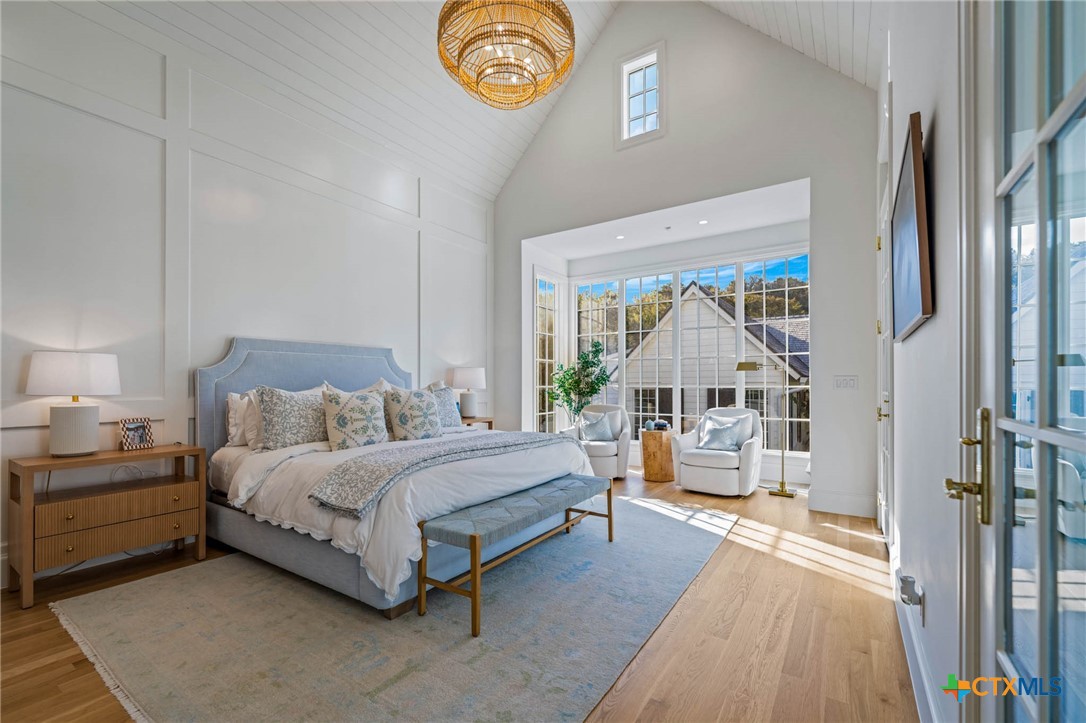 1755 Riada Drive New Braunfels, TX 78132 - Photo 26 of 48 a spacious bedroom with a bed and a large window
