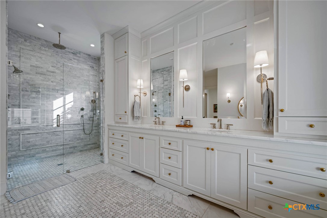 1755 Riada Drive New Braunfels, TX 78132 - Photo 29 of 48 a spacious bathroom with double sink and a mirror