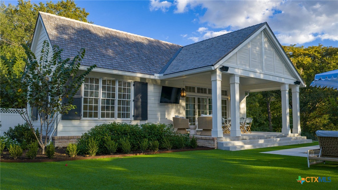 1755 Riada Drive New Braunfels, TX 78132 - Photo 41 of 48 a front view of a house with a yard and porch