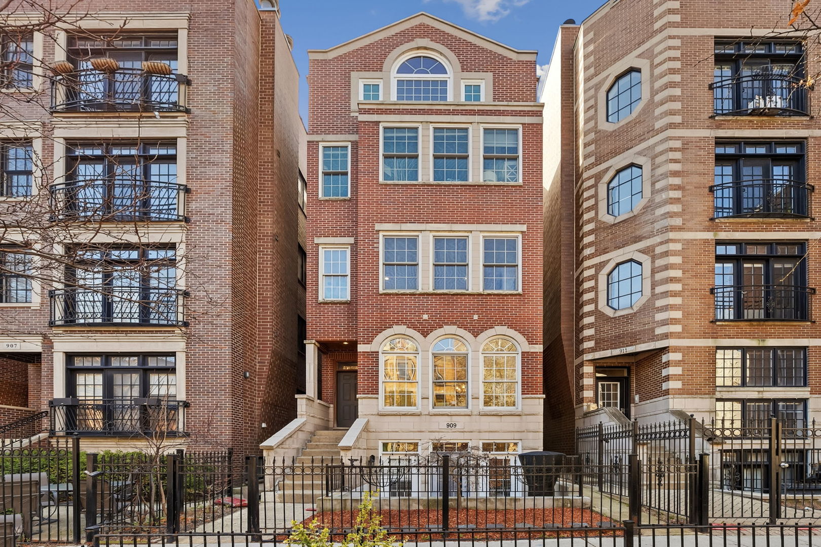 909 West Roscoe Street, Unit 2 Chicago, IL 60657 - Photo 1 of 22 a front view of a brick building with many windows