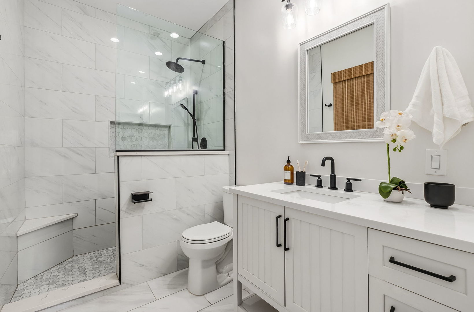 909 West Roscoe Street, Unit 2 Chicago, IL 60657 - Photo 14 of 22 a bathroom with a sink a toilet and shower