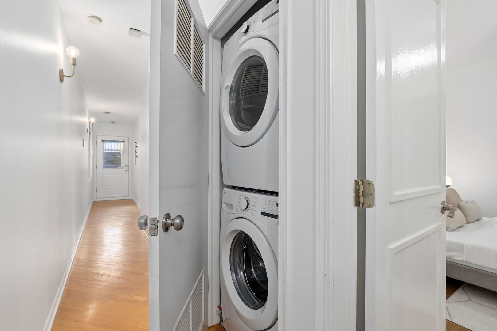 909 West Roscoe Street, Unit 2 Chicago, IL 60657 - Photo 19 of 22 a view of a hallway with washer and dryer