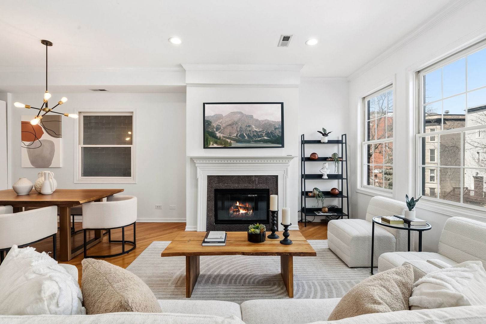909 West Roscoe Street, Unit 2 Chicago, IL 60657 - Photo 3 of 22 a living room with furniture and a fireplace
