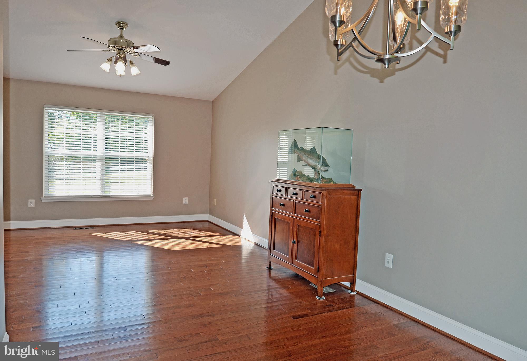 8112 Rugby Road Manassas, VA 20111 - Photo 15 of 38 Sunlit LR with hardwood floor & ceiling fan