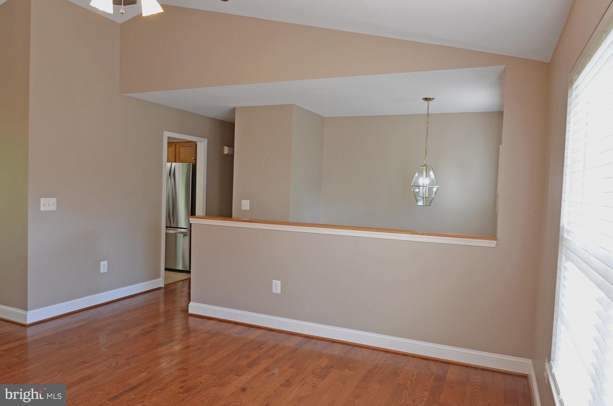 8112 Rugby Road Manassas, VA 20111 - Photo 16 of 38 Living room with cathedral ceiling