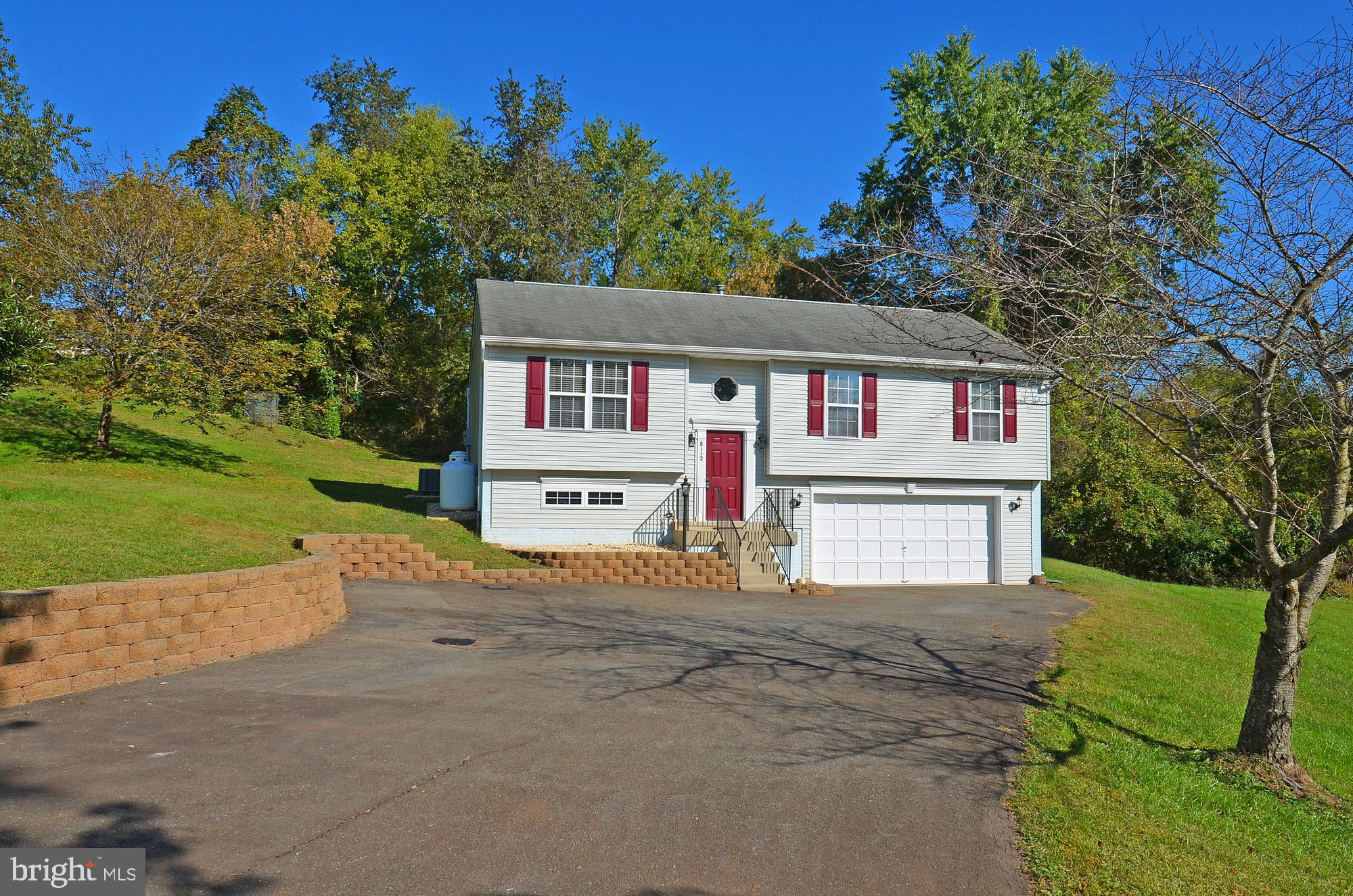 8112 Rugby Road Manassas, VA 20111 - Photo 2 of 38 Widened, paved driveway and new retaining wall