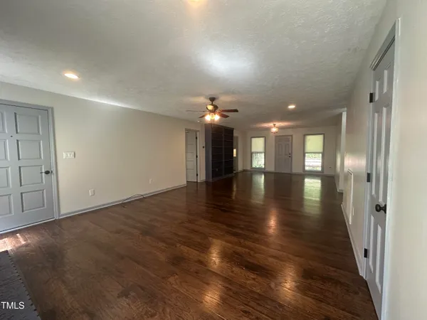 an empty room with wooden floor