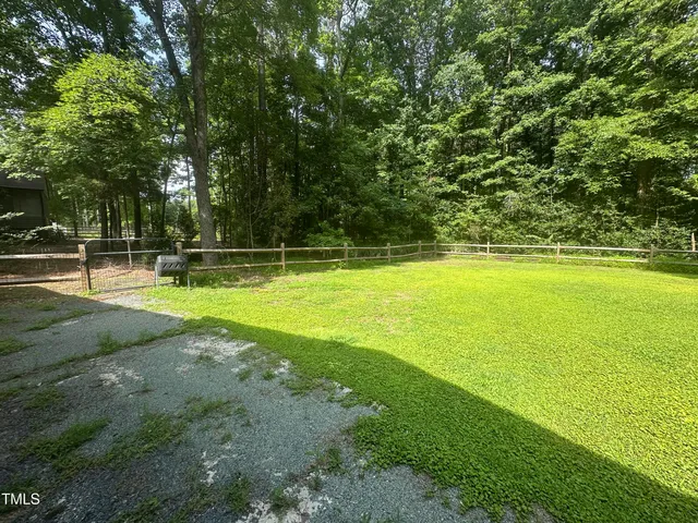 a view of a swimming pool with an outdoor space and seating area