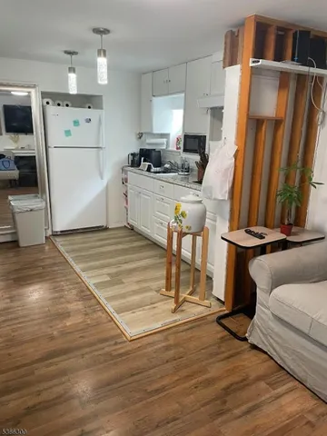 a kitchen with a sink appliances and cabinets