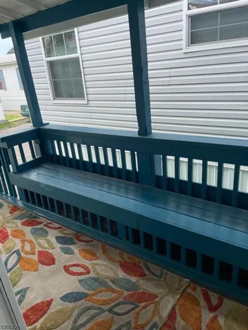 a view of a balcony with chairs