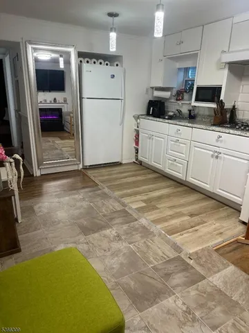 a kitchen with stainless steel appliances a sink stove and refrigerator