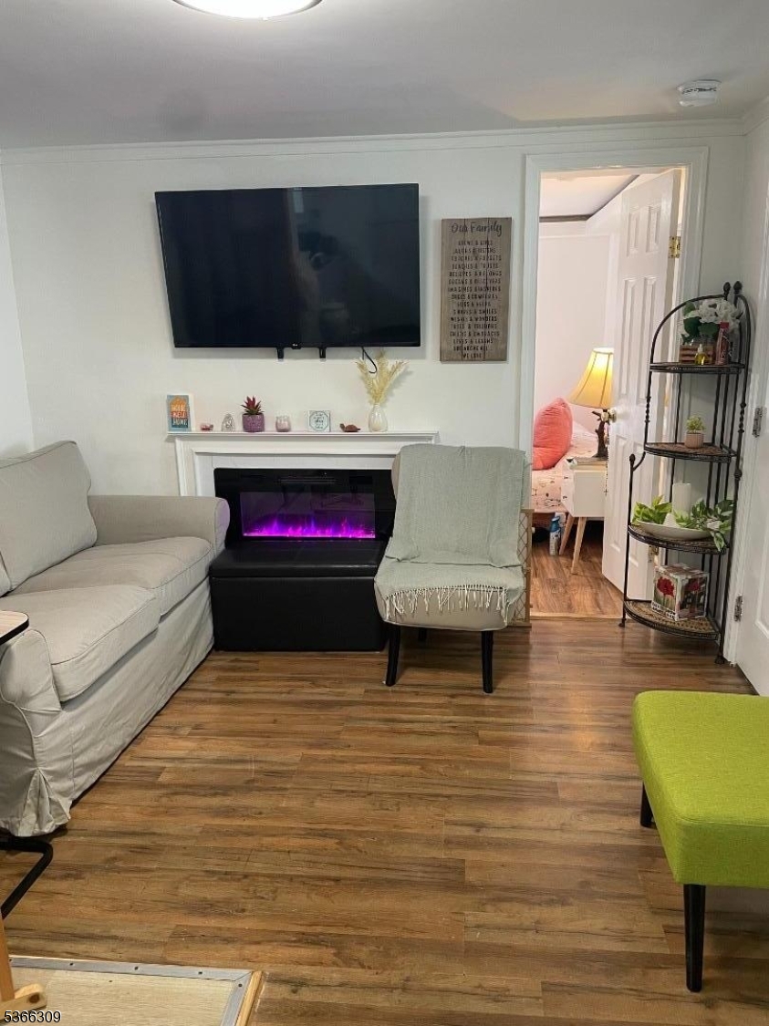 16 Sale Street Moonachie, NJ 07074 - Photo 8 of 13 a living room with furniture and a flat screen tv