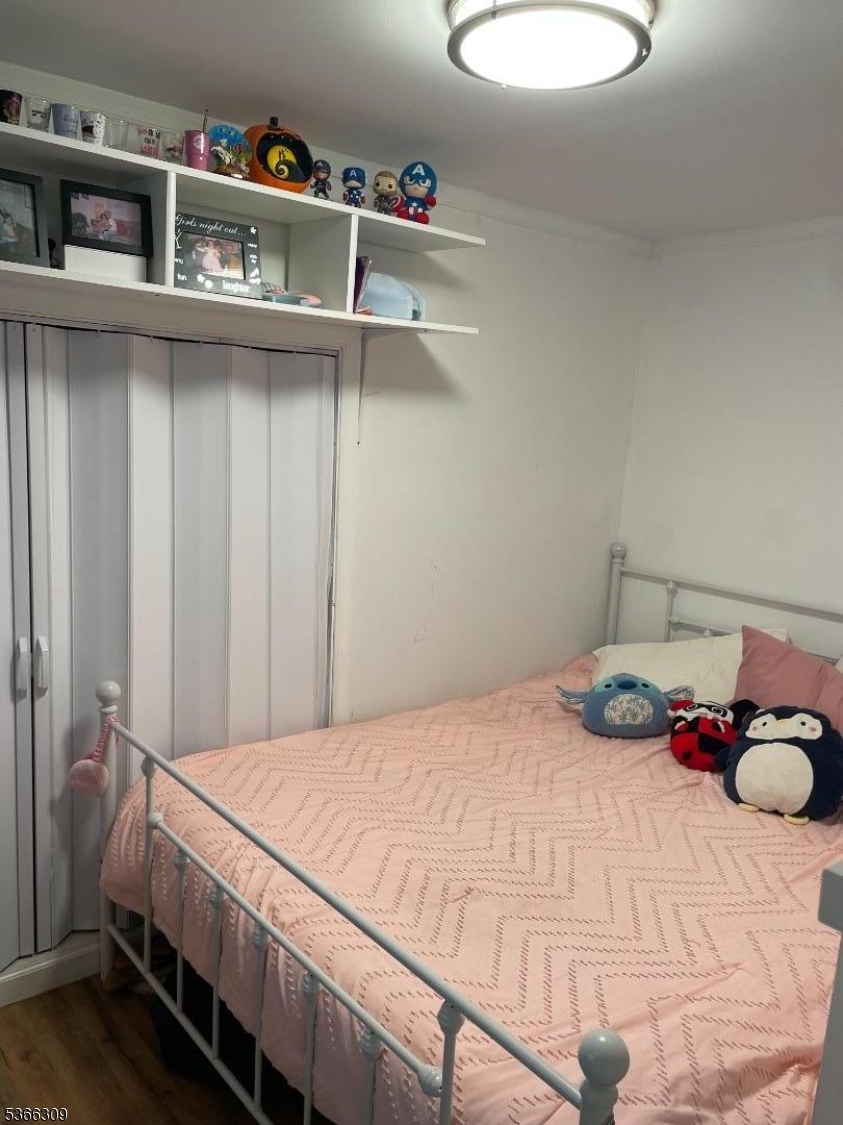 16 Sale Street Moonachie, NJ 07074 - Photo 9 of 13 a bedroom with a bed and a window