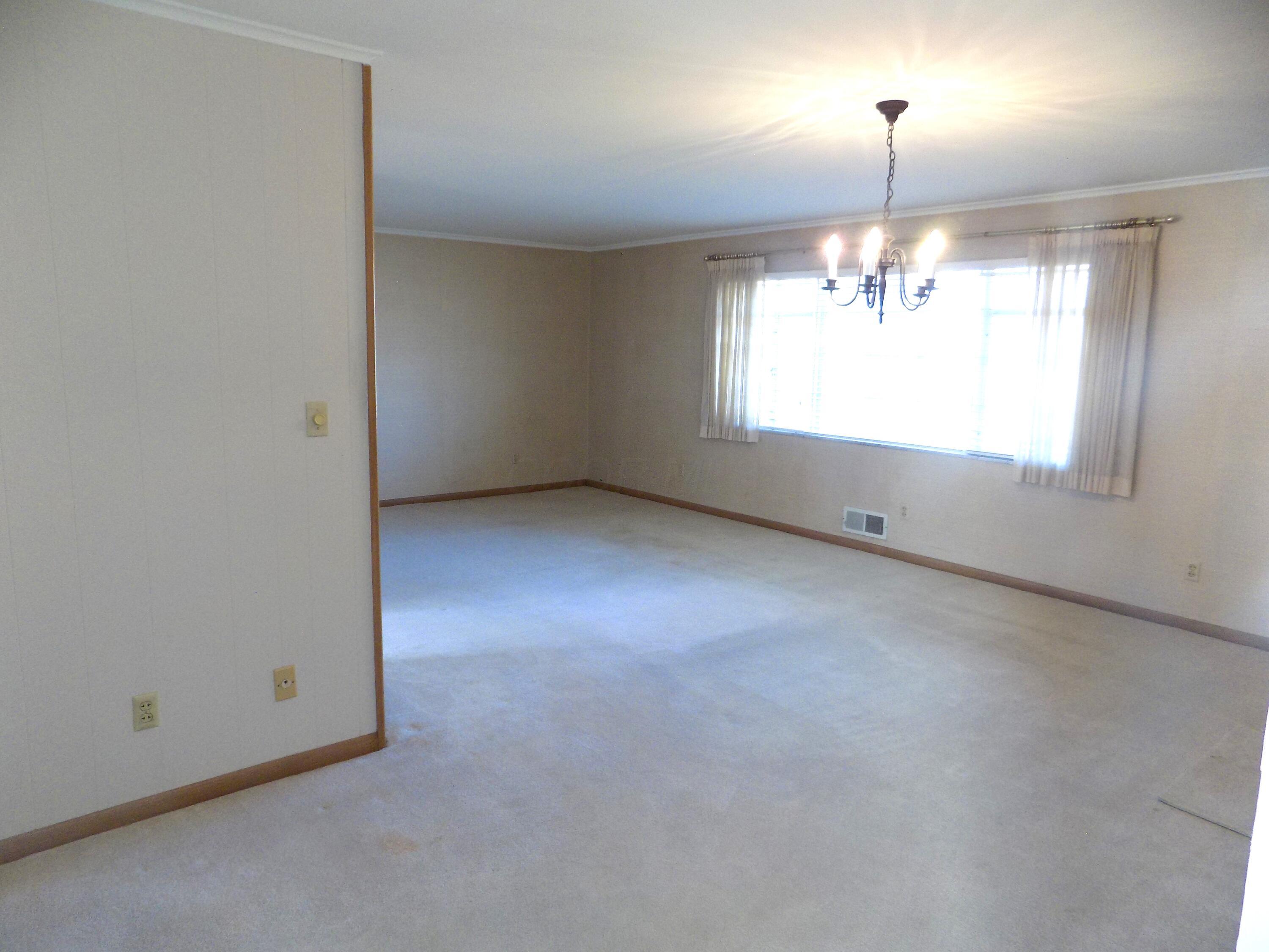 1743 Ardleigh Road Columbus, OH 43221 - Photo 5 of 29 Large space for dining area and there is hardwood floors underneath the carpeting.