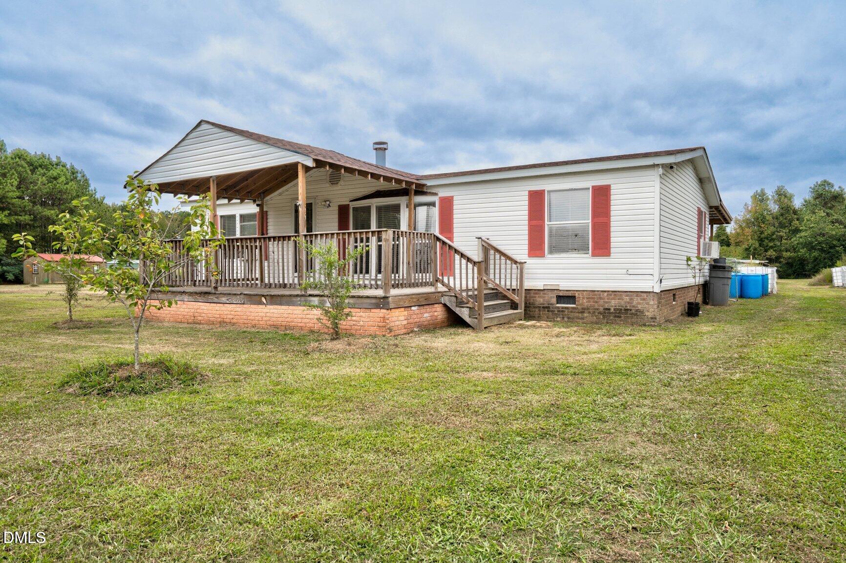 1835 Cokey Road Rocky Mount, NC 27801 - Photo 3 of 42 a house view with swimming pool and garden