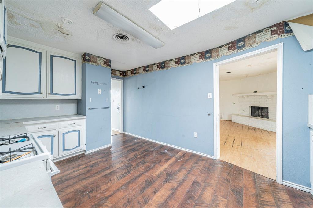 3816 Springbranch Drive Benbrook, TX 76116 - Photo 11 of 27 a view of a kitchen with a sink and a refrigerator