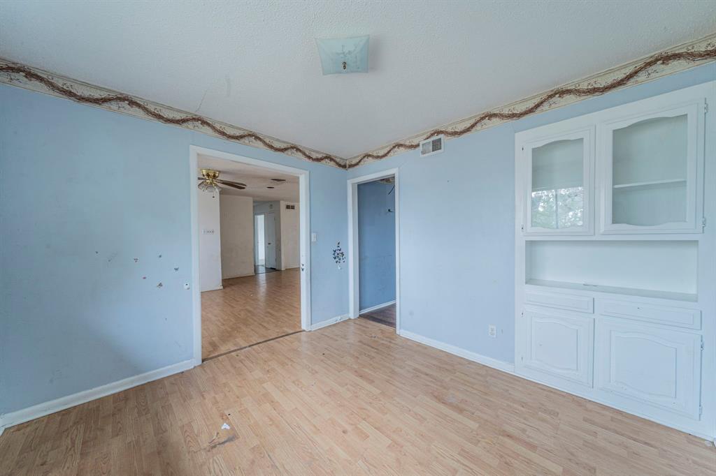 3816 Springbranch Drive Benbrook, TX 76116 - Photo 13 of 27 a view of a big room with wooden floor and windows