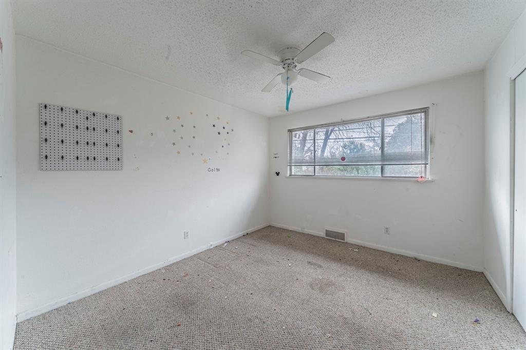 3816 Springbranch Drive Benbrook, TX 76116 - Photo 17 of 27 an empty room with a window