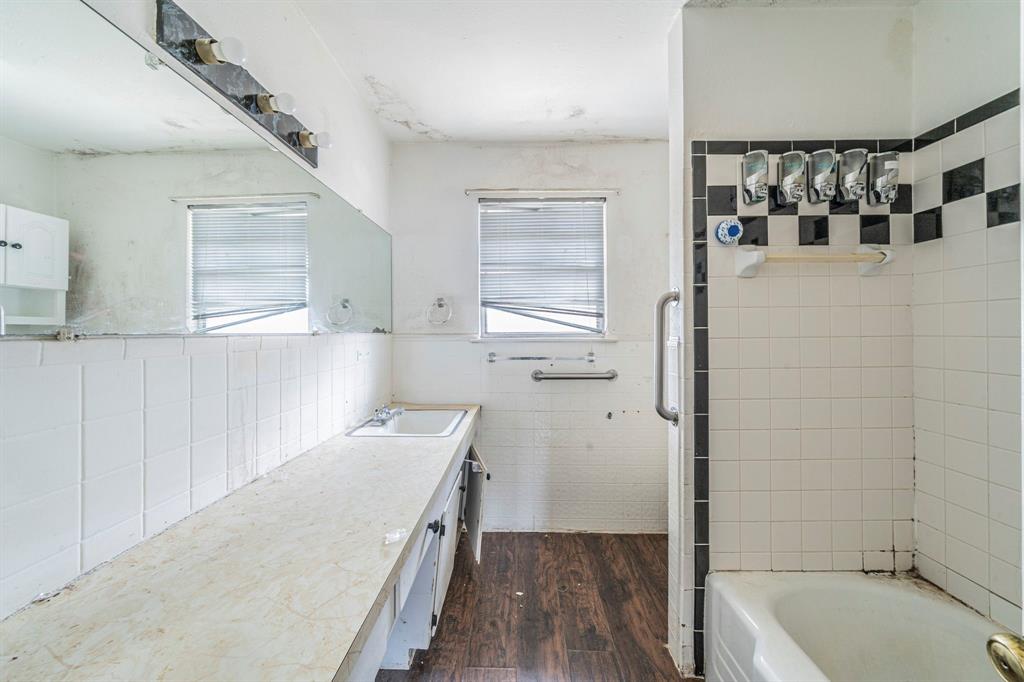 3816 Springbranch Drive Benbrook, TX 76116 - Photo 19 of 27 a bathroom with a tub sink and mirror