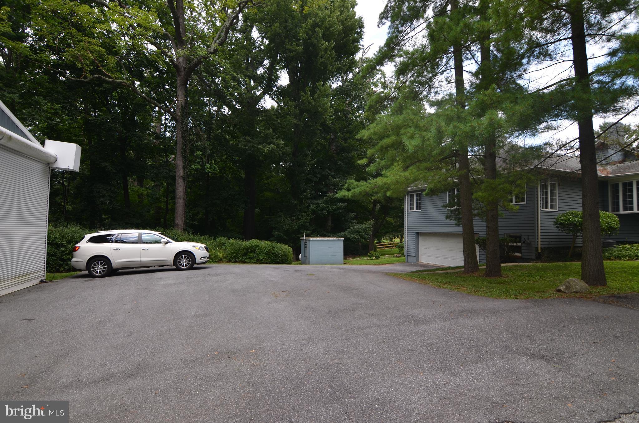 458 Garrison Forest Road Owings Mills, MD 21117 - Photo 1 of 22 Parking area with RV garage behind the car