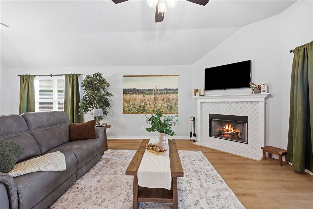 3112 Margaret Rudder Parkway Bryan, TX 77808 - Photo 4 of 24 a living room with furniture and a fireplace
