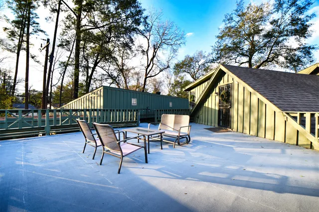 a patio with a table and chairs