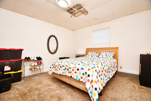 a kitchen with stainless steel appliances wooden floor dining table and chairs