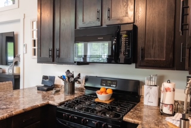 8 Holly Tree Court Monteagle, TN 37356 - Photo 8 of 14 a kitchen with stainless steel appliances granite countertop a stove and cabinets