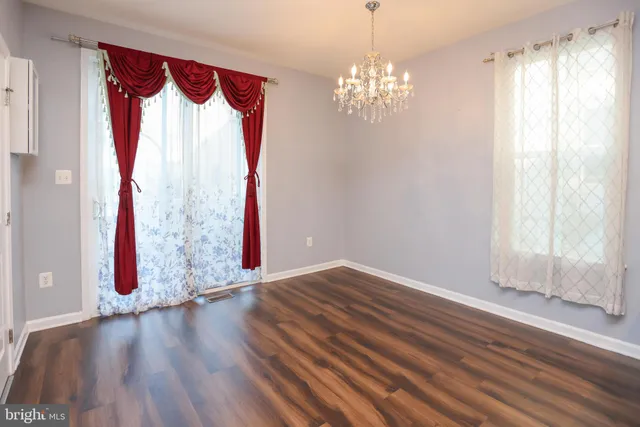a view of a room with wooden floor and walls