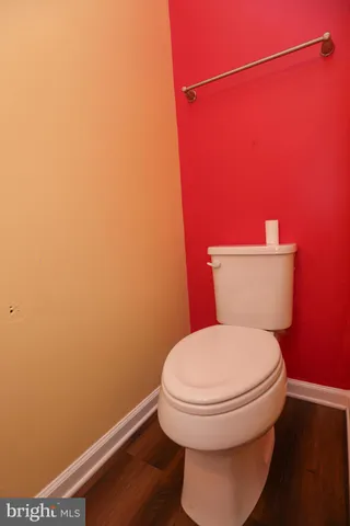 a bathroom with a toilet and a sink