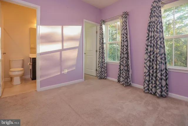 a view of entryway with window and brick walls
