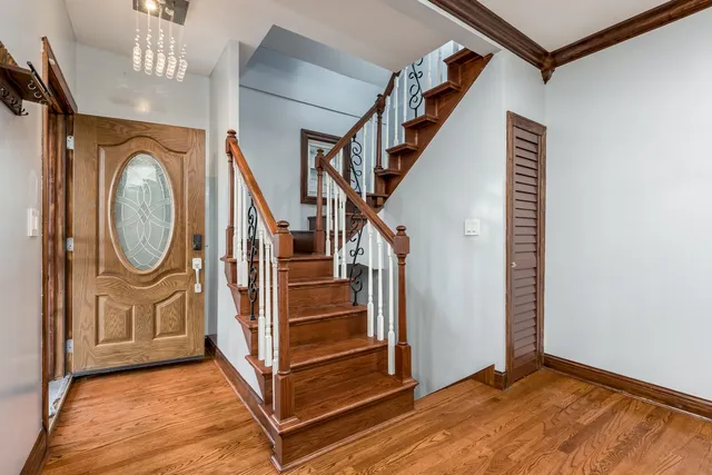 a view of a hallway with painted walls and stairs