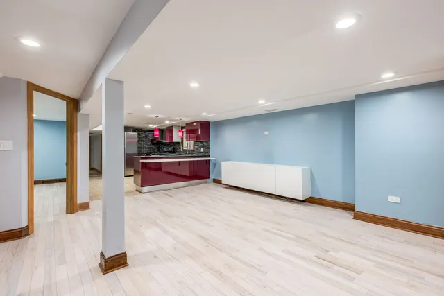a view of kitchen and hall with wooden floor
