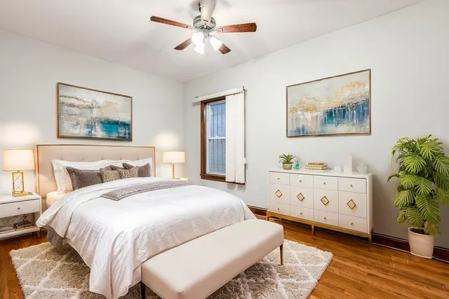 a bedroom with a bed and a dresser