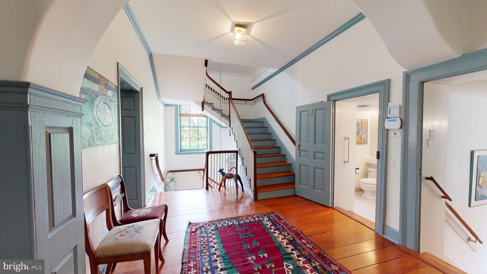 27295 Southside Island Creek Road Trappe, MD 21673 - Photo 19 of 91 a living room with furniture and a wooden floor