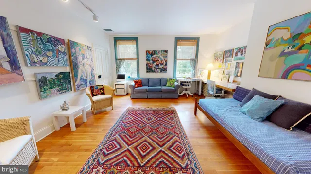 a roof deck with a table and chairs