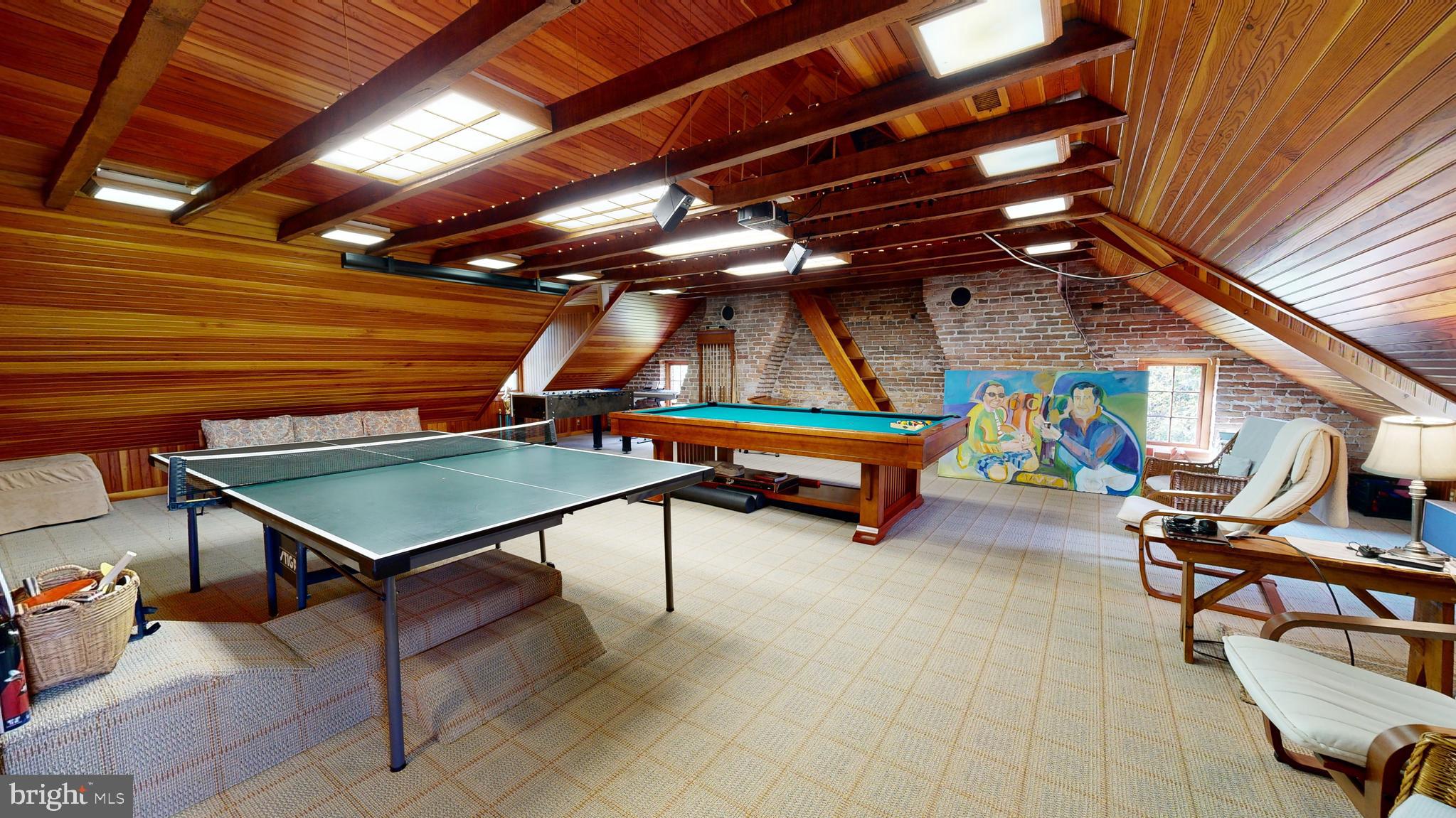 27295 Southside Island Creek Road Trappe, MD 21673 - Photo 30 of 91 a roof deck with a table and chairs