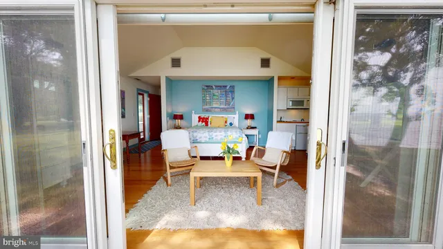 a car parked in front of white house