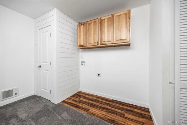 a bathroom with a granite countertop sink a toilet and a mirror