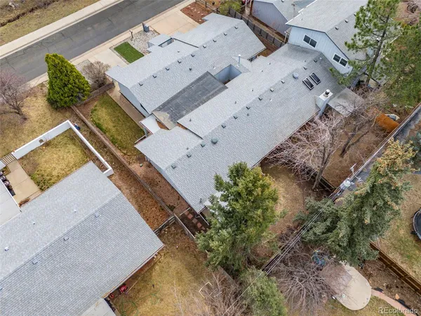 a aerial view of a house with a yard