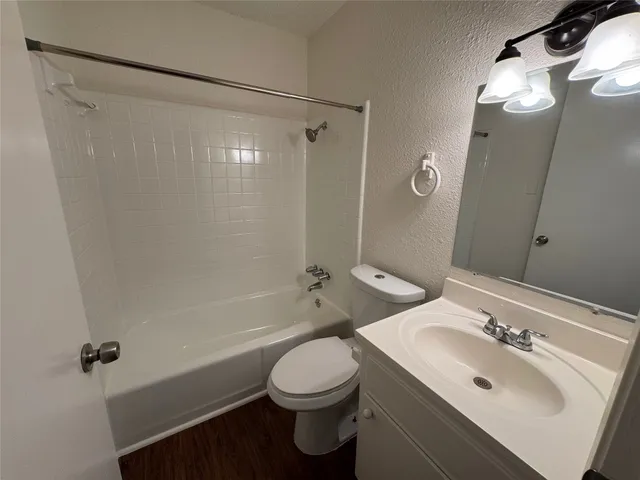 a bathroom with a sink toilet and tub
