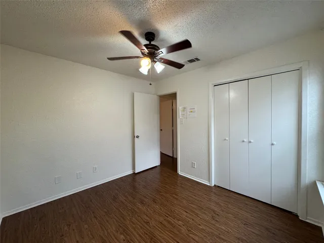 a view of front door with wooden floor