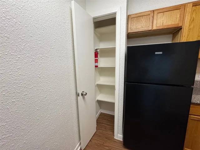 a kitchen with a stove and a refrigerator