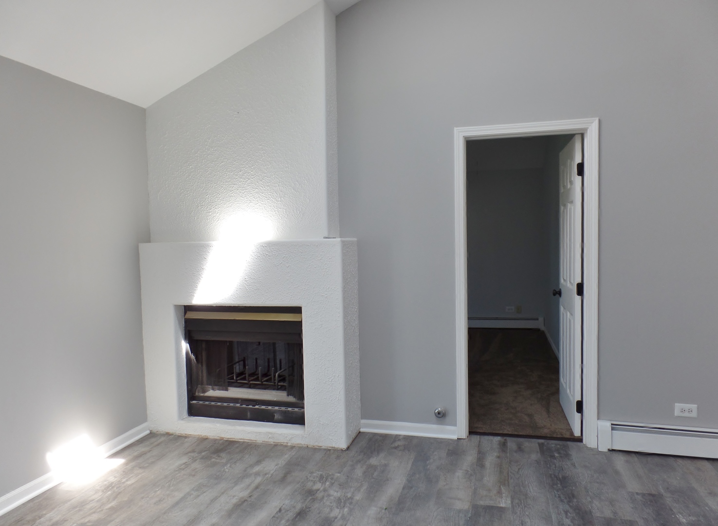 1504 Comanche Drive Bolingbrook, IL 60490 - Photo 13 of 34 an empty room with wooden floor fireplace and window