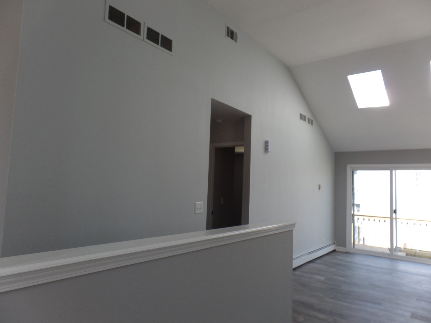 1504 Comanche Drive Bolingbrook, IL 60490 - Photo 14 of 34 an empty room with wooden floor and windows