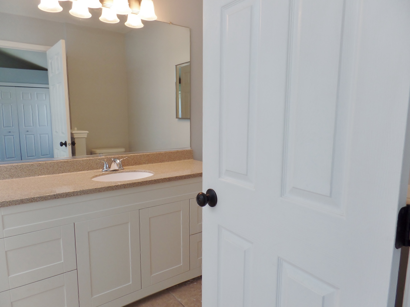 1504 Comanche Drive Bolingbrook, IL 60490 - Photo 17 of 34 a bathroom with a sink and vanity