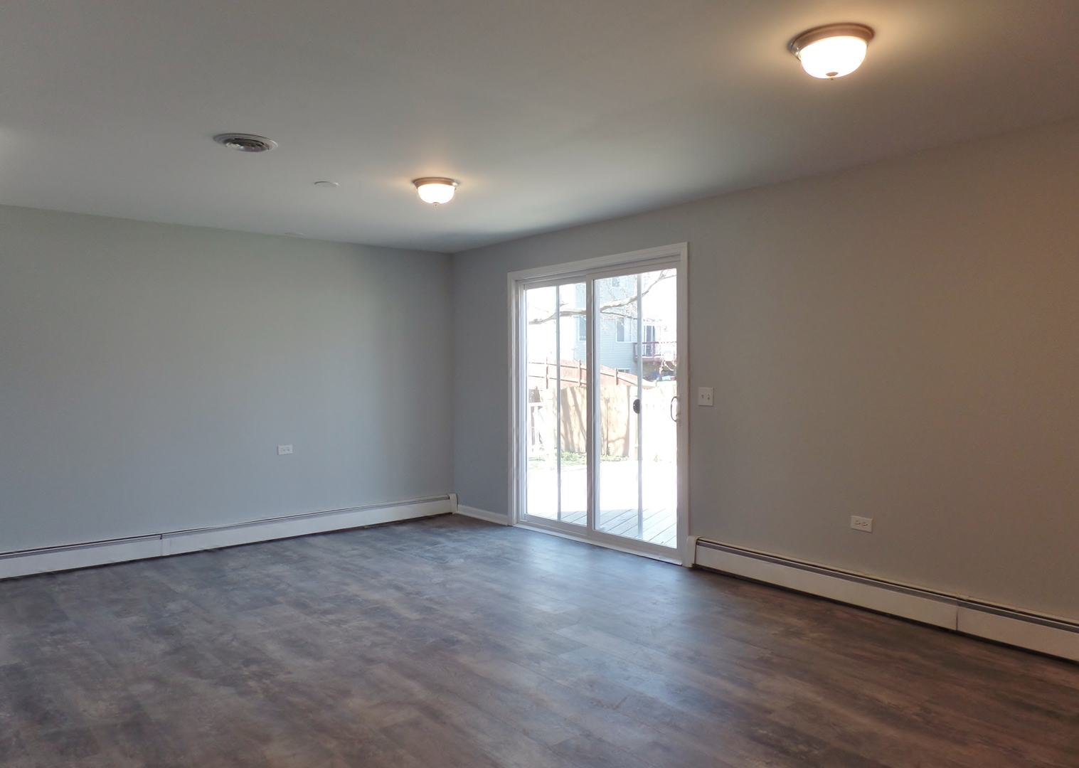 1504 Comanche Drive Bolingbrook, IL 60490 - Photo 22 of 34 an empty room with wooden floor and windows