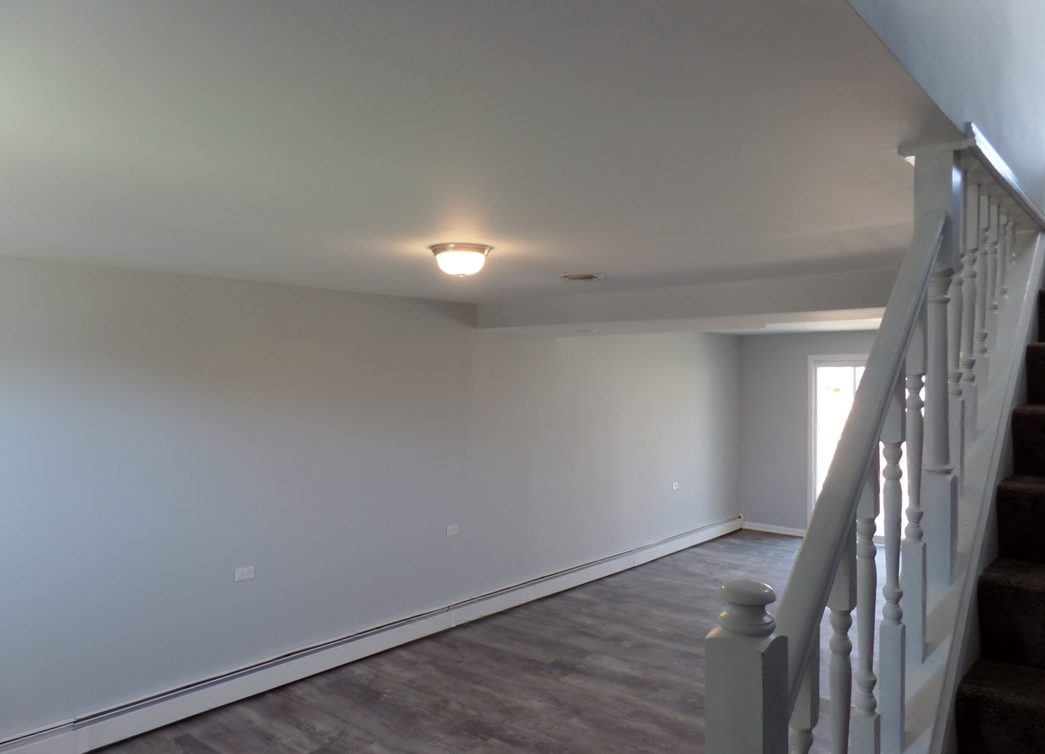 1504 Comanche Drive Bolingbrook, IL 60490 - Photo 23 of 34 an empty room with wooden floor and door