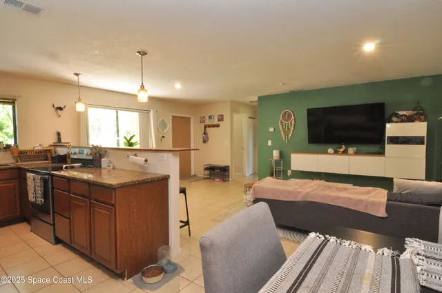 a living room with a couch and a flat screen tv
